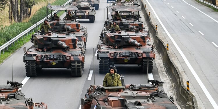 A column of Greek tanks in a parade.