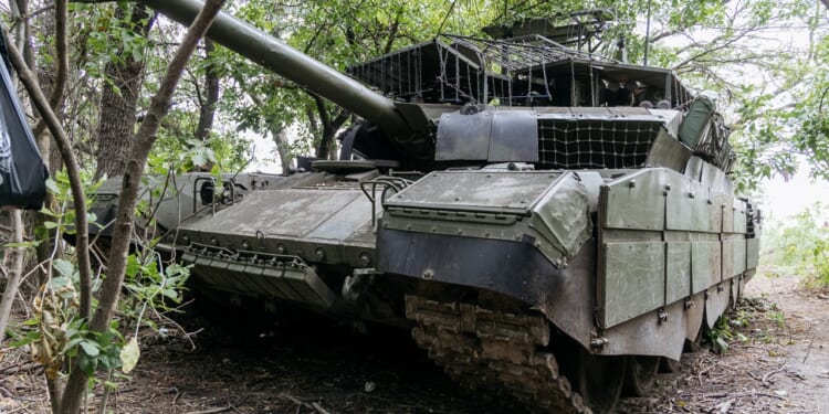 A Russian tank with improvised armor.