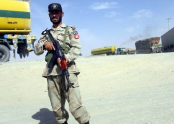 Pakistani soldier stands near the Afghan border.