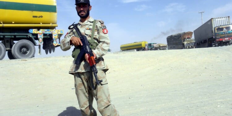 Pakistani soldier stands near the Afghan border.
