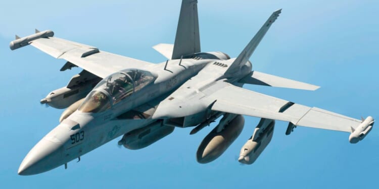 A U.S. Navy EA-18G Growler assigned to the USS Carl Vinson breaks away from a U.S. Air Force KC-135 Stratotanker from the 909th Air Refueling Squadron after conducting in-air refueling May 3, 2017, over the Western Pacific Ocean.