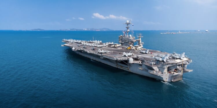 A US Navy aircraft carrier at sea.