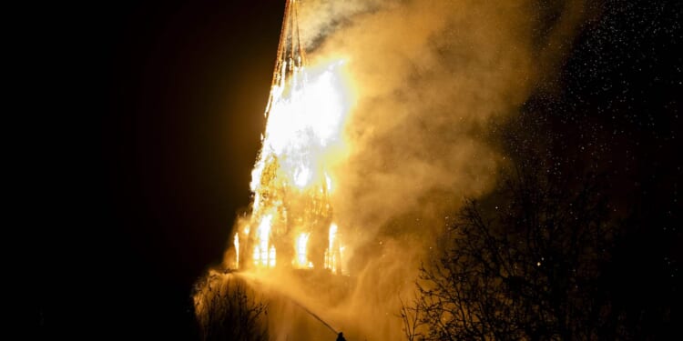 A fire tears through the Vondelkerk church tower in Amsterdam on New Year’s Day, Jan. 1, 2026.