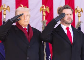 Trump and Vance saluting during a Veterans' Day observance.