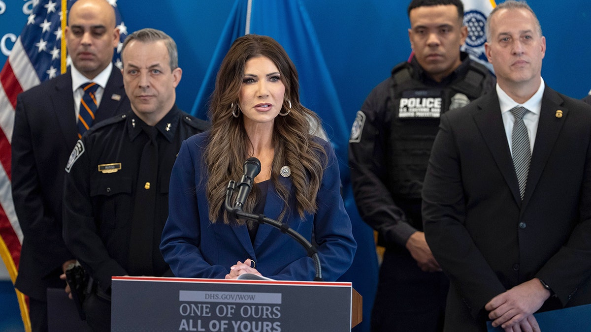 Homeland Security Secretary Kristi Noem speaks at podium