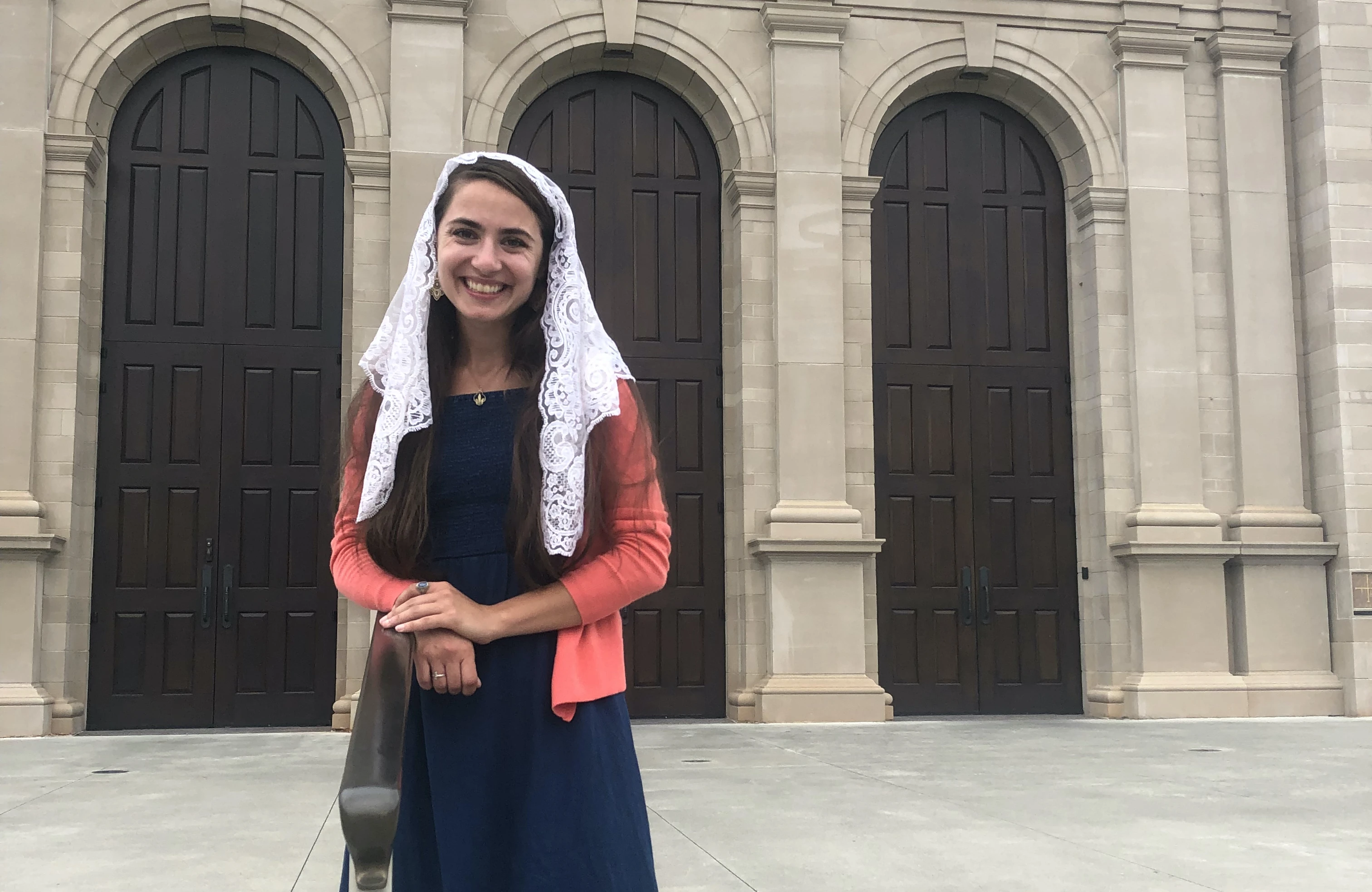 Elizabeth Sisk stands in front of Holy Name of Jesus Cathedral in Raleigh, North Carolina.