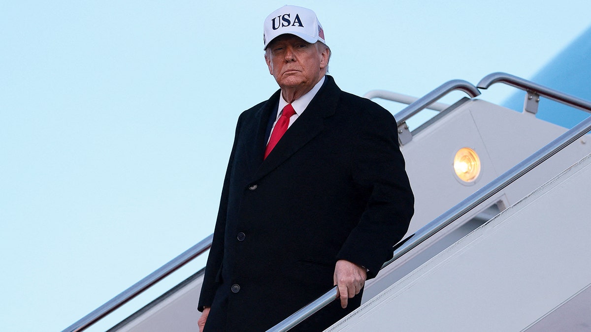 President Donald Trump walks off Air Force One