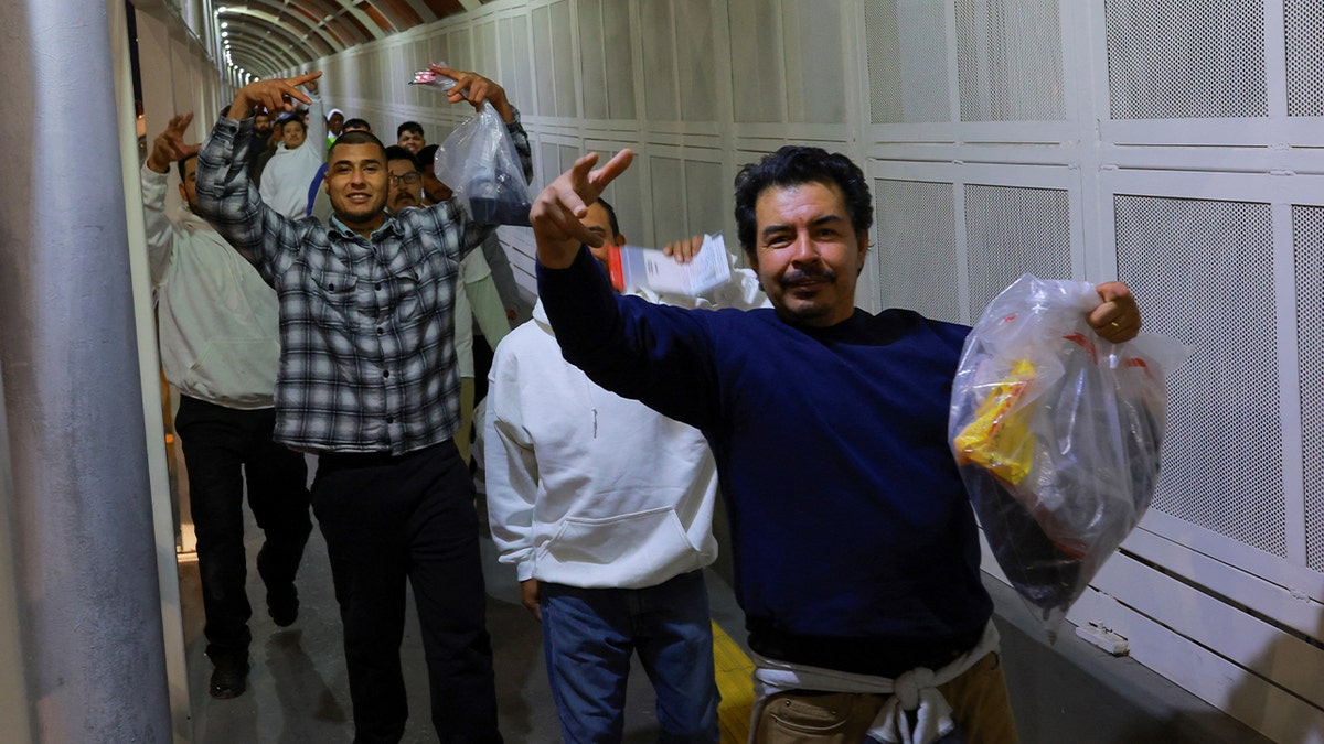 Edgar Ocampo, a Mexican migrant who said he was detained by U.S. Immigration and Customs Enforcement (ICE) agents in Minnesota, carries his belongings as he walks with other migrants across the Paso del Norte International border brigde after being deported from the U.S., in Ciudad Juarez, Mexico, January 15, 2026.