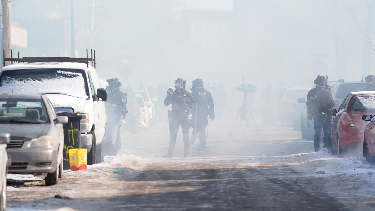 Federal agents stand in tear gas