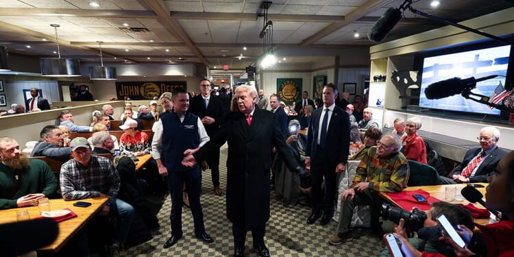 President Donald Trump receives prayer from Iowa restaurant patron