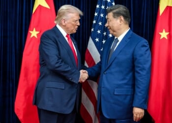 Trump and Xi shaking hands.