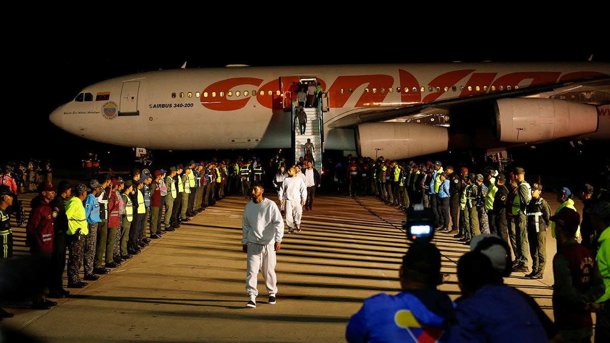 Venezuelan migrants depart a deportation flight