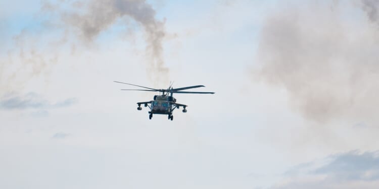 Smoke coming from a Black Hawk helicopter.