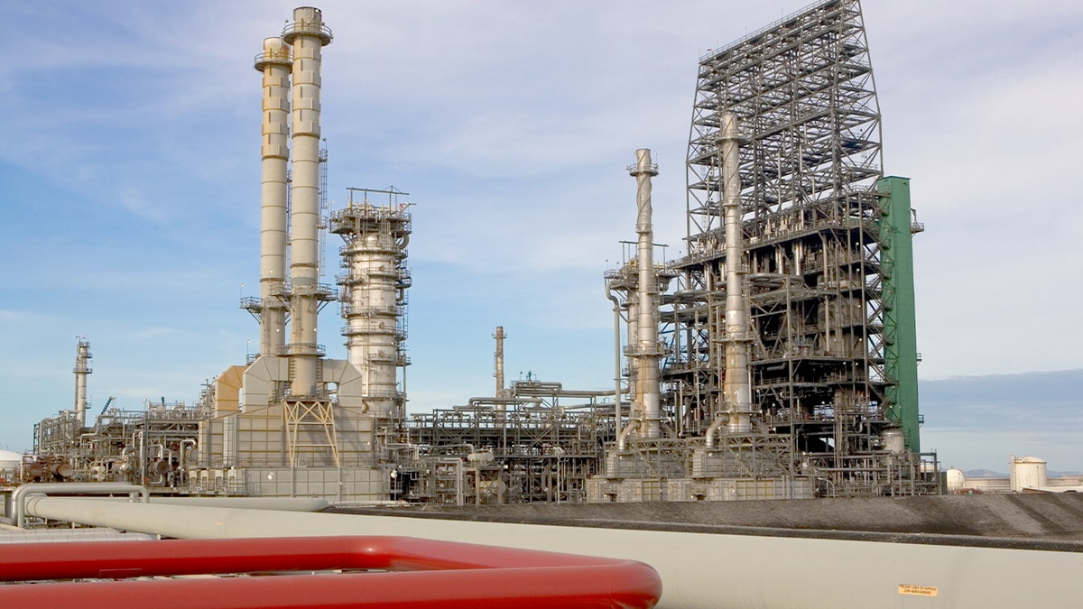 Industrial oil processing equipment and storage tanks stand at the Cerro Negro heavy-oil upgrader facility.