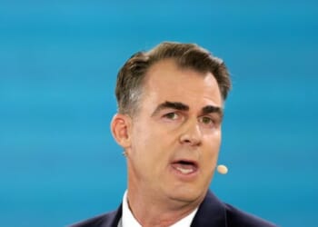 GOP Gov. Stitt Tells Trump to 'Calm' Politics by Letting States Import Migrants