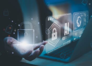 AI cybersecurity concept with businessman holding digital padlock icon, futuristic virtual interface displaying secure access and data protection, symbolizing artificial intelligence privacy systems.