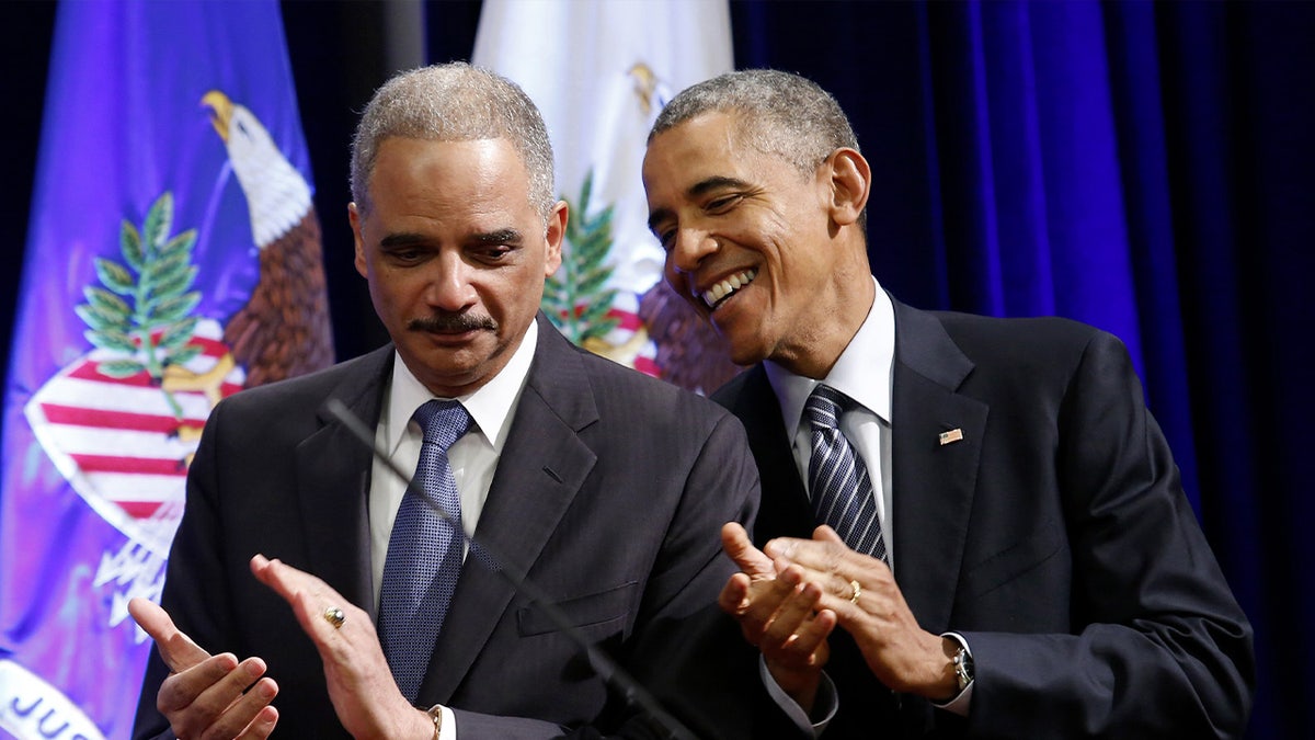 Obama and Holder chatting 