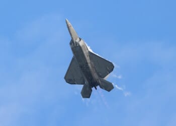 An F-22 completing a tight aerial maneuver.