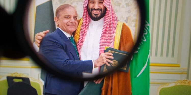 Shehbaz Sharif and Mohammed bin Salman hugging.
