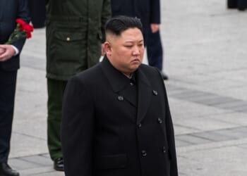 Kim Jong-un wearing all black.