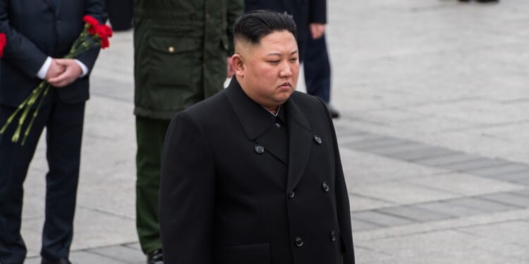 Kim Jong-un wearing all black.