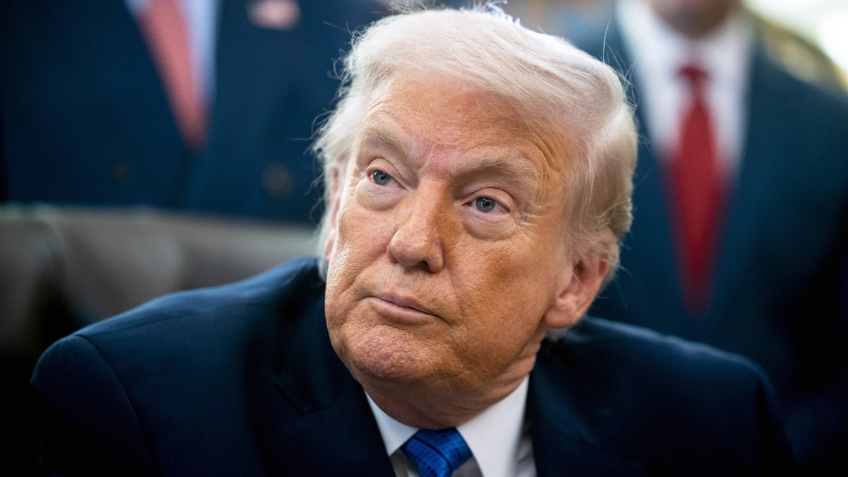 Trump with a neutral expression