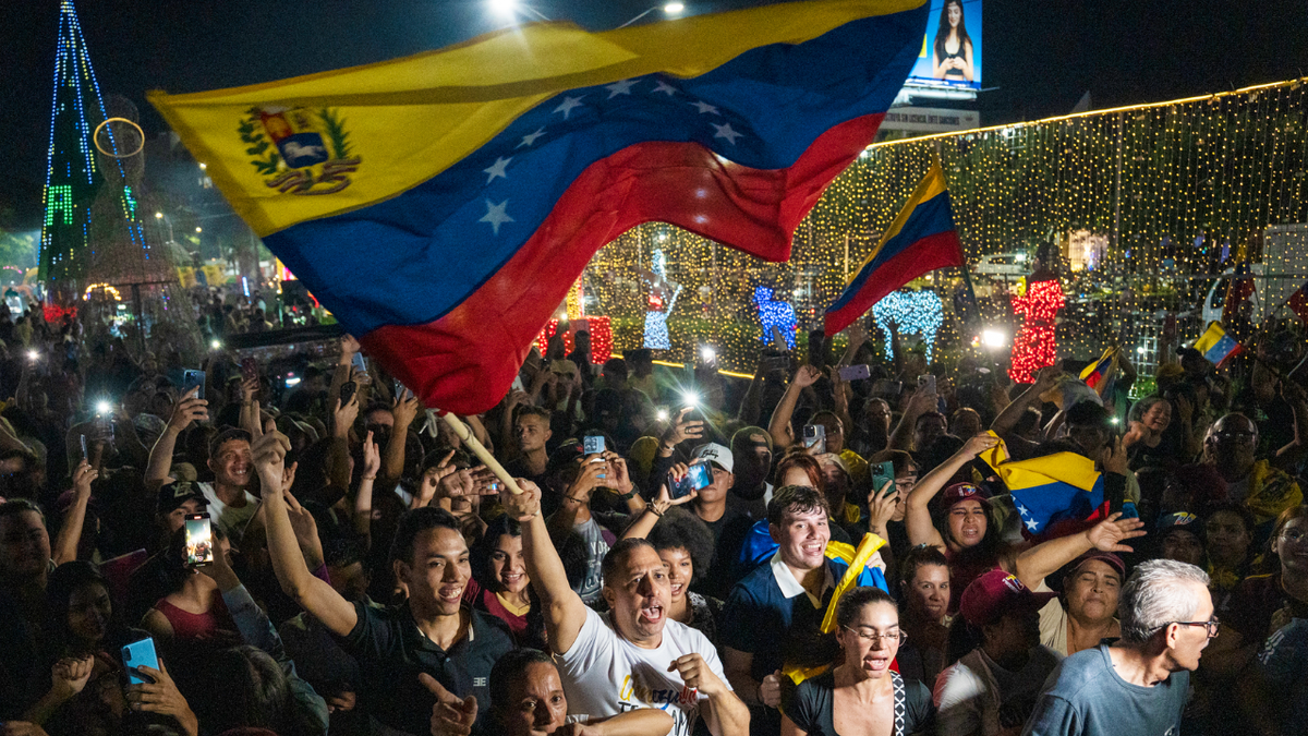 Venezuelan citizens celebrate in the streets following the capture of Venezuelan President Nicolas Maduro.