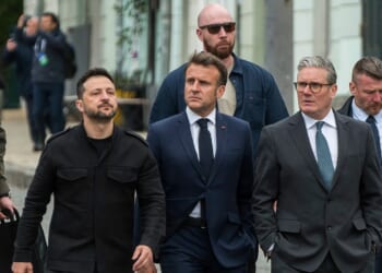 Zelensky, Starmer, and Macron walking together.