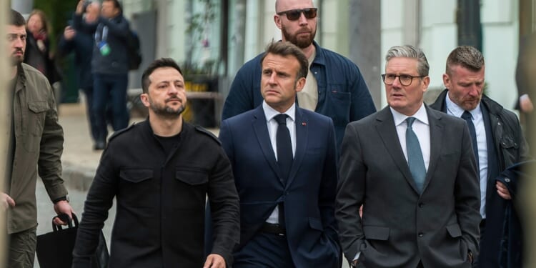 Zelensky, Starmer, and Macron walking together.