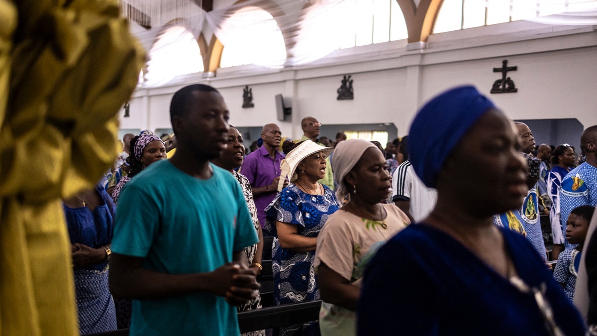 Catholics gather for a mass at the Church of the Assumption in Lagos on April 21, 2025.