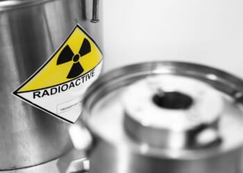 Radioactive waste of nuclear energy power plant of fuel uranium in barrel is sent for reprocessing and burial.