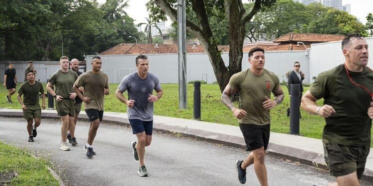 Pete Hegseth running with soldiers.