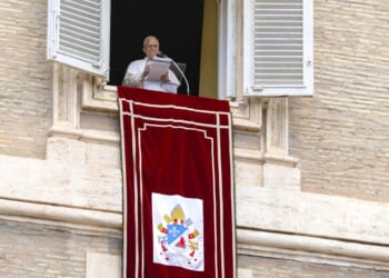 Pope Leo XIV speaks from a window of the Apostolic Palace overlooking St. Peter’s Square during the Sunday Angelus on Aug. 24, 2025.