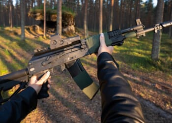 A person holding an AK-12 assault rifle.