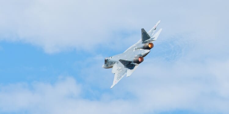 A Su-57 fighter in flight.
