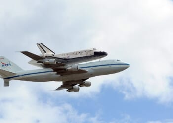 The space shuttle Discovery in flight.