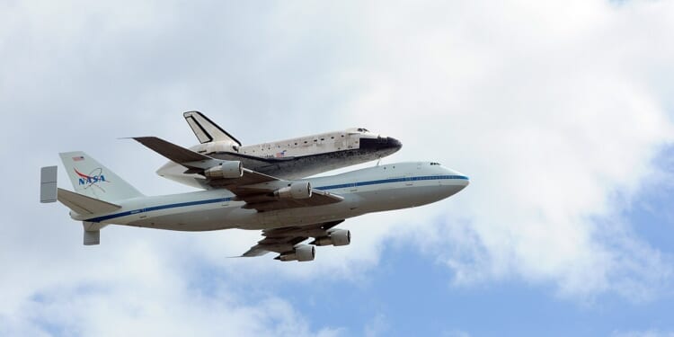 The space shuttle Discovery in flight.