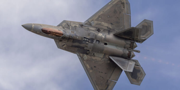 An F-22 Raptor flies overhead during an aerial demonstration at Marine Corps Air Station Kaneohe Bay, Hawaii, Aug. 9, 2025.