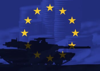 A tank against a European Union flag backdrop.