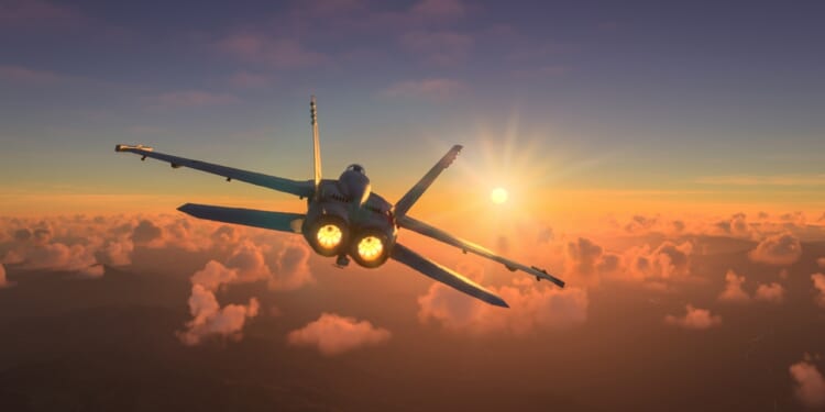 An F/A-18 Hornet in flight at dusk.