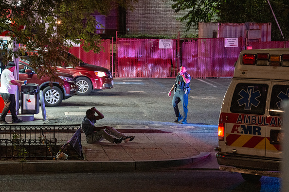 Washington Metropolitan Police Department officers come to the aid of an assault victim.