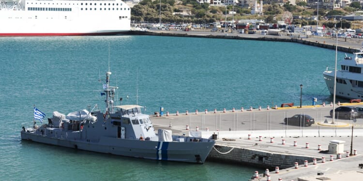 A warship in port in Greece.