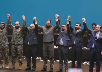 Syrian president Ahmed al-Shara celebrates with comrades.