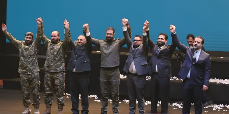 Syrian president Ahmed al-Shara celebrates with comrades.