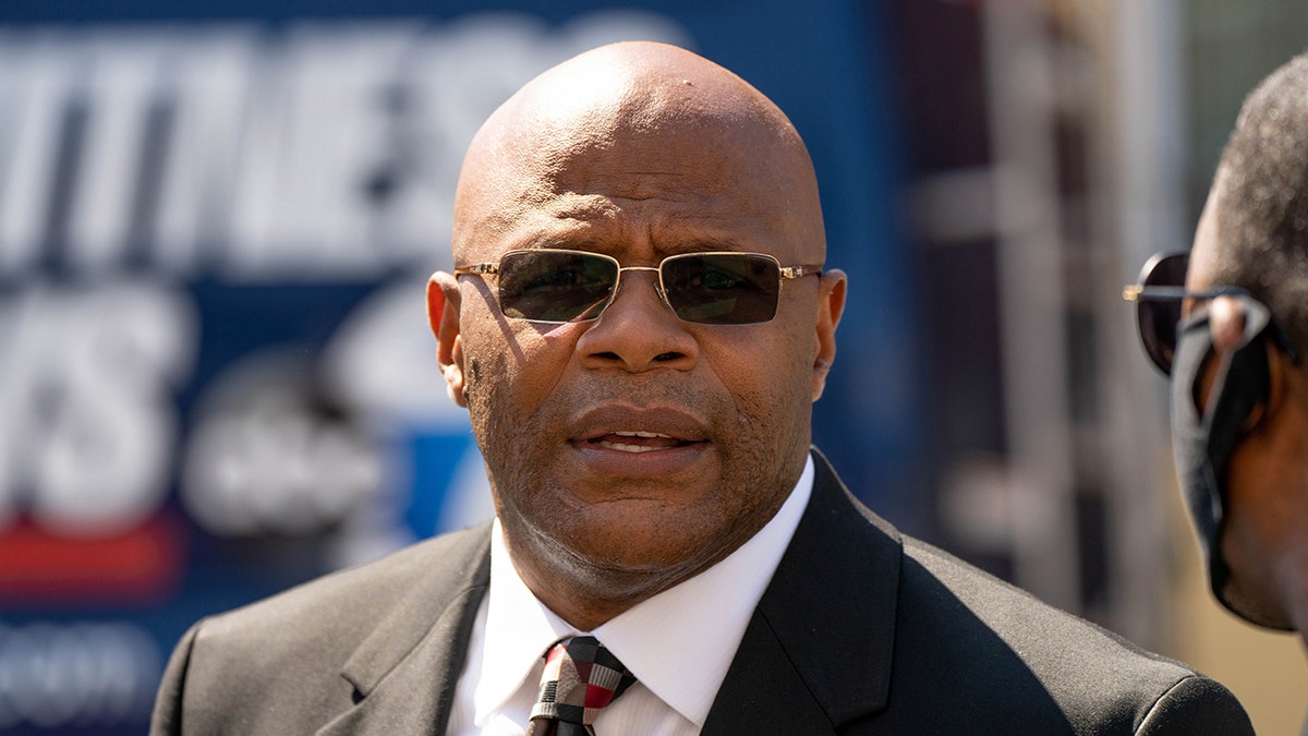 tony herbert wearing sunglasses and suit