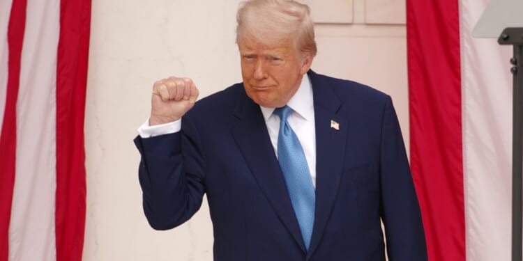 President Donald Trump raising a fist.