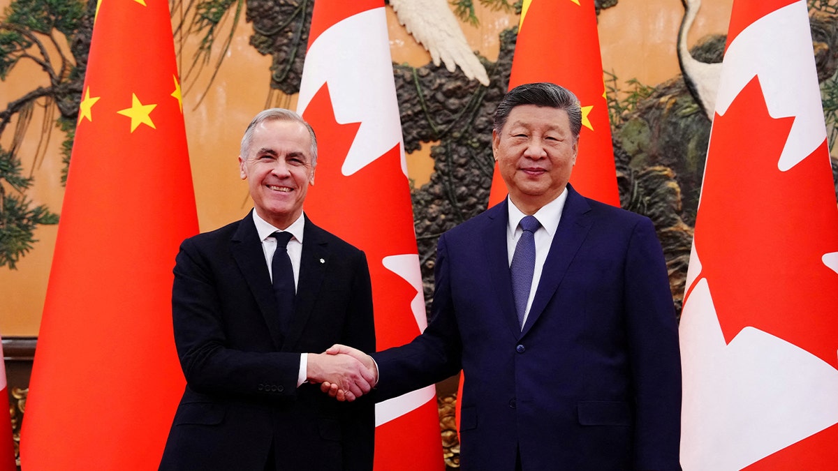 Canadian Prime Minister Mark Carney shakes hands with President of China Xi Jinping at the Great Hall of the People in Beijing, China on Friday, Jan. 16, 2026.
