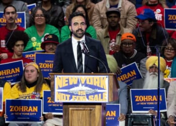 Zohran Mamdani as mayoral candidate addresses crowd.