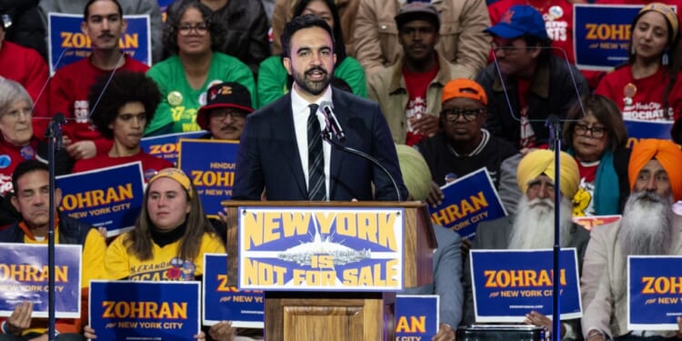 Zohran Mamdani as mayoral candidate addresses crowd.