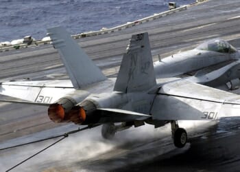 An F/A-18 Hornet landing on an aircraft carrier.
